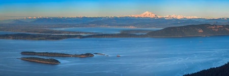 Aerial view from the San Juan Islands with Mount Baker on the horizon, Washington, USAの写真素材