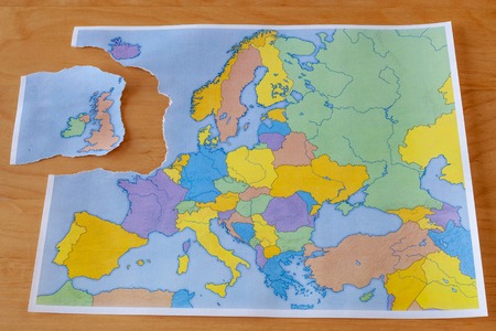 a torn paper map symbolizing the UK leaving the European Union or Brexitの写真素材