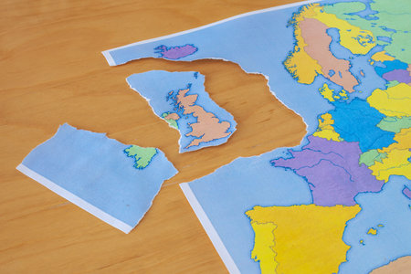 a torn paper map symbolizing the UK leaving the European Union or Brexit
