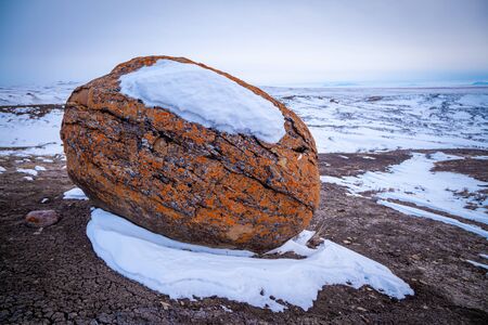 Large red boulders at Red Rock Coulee, Alberta, Canada in the evening on a cold winter dayの写真素材