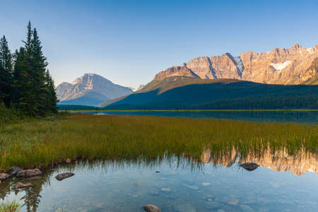 Howse Peak relected in Waterfowl Lake in Banff National Park, Alberta, Canada at sunriseの写真素材