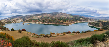 Beautiful water reservoir under the cloudy sky. Cyprusの写真素材