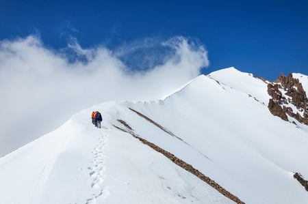 Group of climbers goes down from the top of Erciyes volcano. Turkeyの写真素材