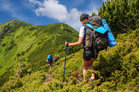 Ukraine. Carpathian mountains. A group of tourists with big backpacksの写真素材