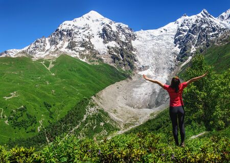 Young hikers trekking in Svaneti, Georgia. Glacier ladaar in the backgroundの写真素材