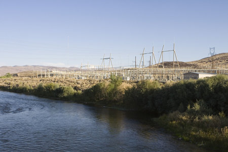 Power company on edge of river.