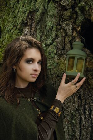 Samhain witch with a lantern, the image embodies the witch or elf. Fantasyの写真素材