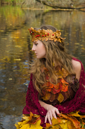 forest witch in fall way, dress from the leavesの写真素材