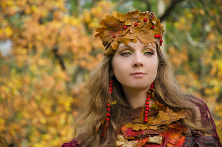 Autumn Witch in forestの写真素材