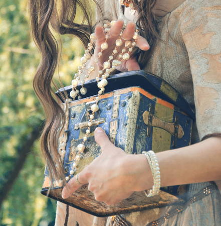 old treasure chest in female handsの写真素材