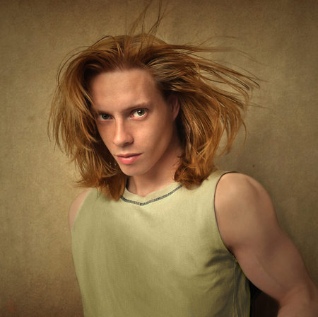 long-haired guy on vintage backgroundの写真素材