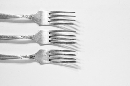 three forks, a canteen and a shadow - backgroundの写真素材