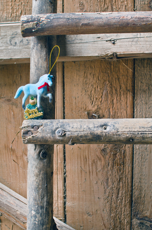 Christmas toy - horse on old wooden stairsの写真素材