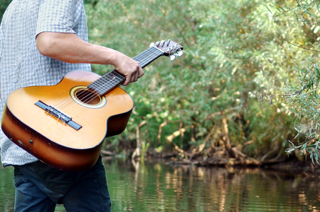 guitar in hand close-upの写真素材