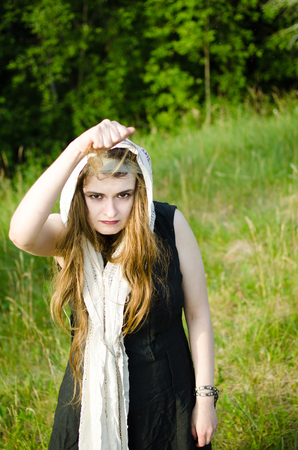witch tore out a piece of hair and now threatens to bring damageの写真素材