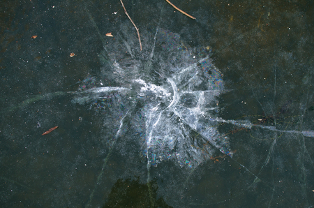cracks on the ice surface-background imageの写真素材