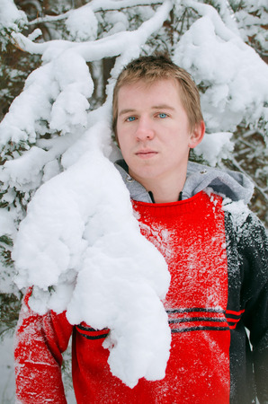guy in the winter forest for a walkの写真素材