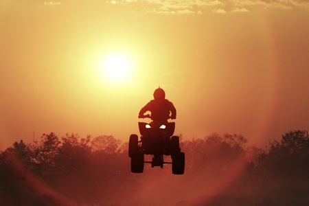 Silhouette ATV jumpの写真素材