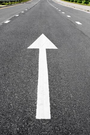 Arrow signs as road markings on a streetの写真素材