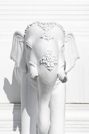 white elephants sculpture on wallの写真素材