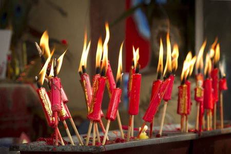 Red candles in chinese temple の写真素材