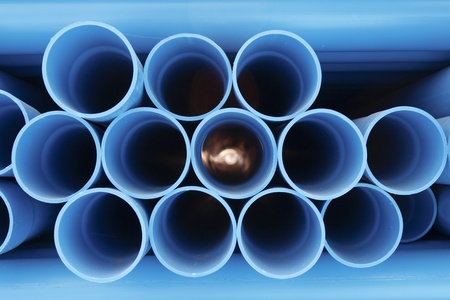 PVC pipes stacked in construction site の写真素材