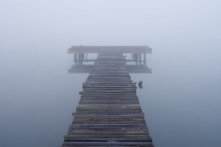 old jetty walkway pier at the lake in morning