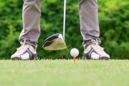 golfer ready to tee offの写真素材