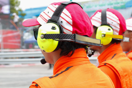 Motor sport rescue team with headphones