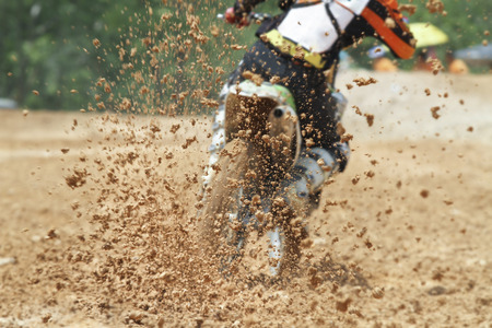 Mud debris flying from a motocross raceの写真素材