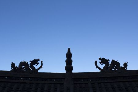 Dragon Silhouette on the the chinese temple roofの写真素材