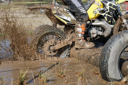 Enduro wheel in muddy track ,climb wood obstacle