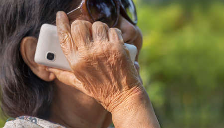 senior woman talking on mobile phoneの写真素材