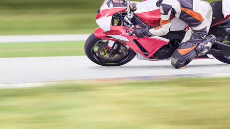 Motorcycle leaning into a fast cornerの写真素材