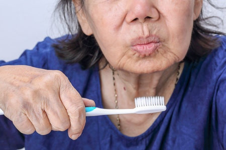 Asian elderly woman with a toothbrush. Dental healthの写真素材
