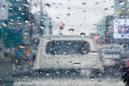 Raindrops on windshield from inside the car in traffic jamの写真素材