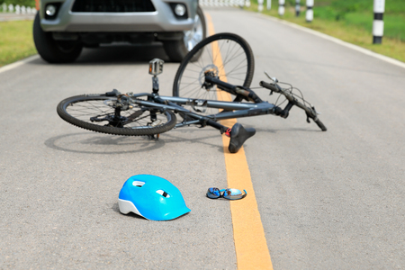Accident car crash with bicycle on roadの写真素材