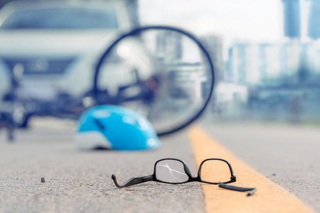 Accident car crash with bicycle on roadの写真素材