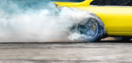 Race drift car burning tires on speed trackの写真素材