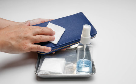 Cleaning wallet with alcohol to protection from coronavirus Covid-19