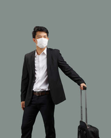 New normal lifestyle ,Business man travelling and wearing face mask protect coronavirus covid-19の写真素材