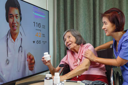 Elderly woman meet online doctor to consultant about health.の写真素材
