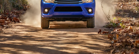 4x4 SUV car driving on a dusty dirt road