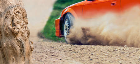 Rally race car drifting on dirt track.の写真素材