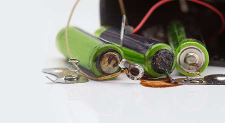 The old battery was leaking hazardous waste.の写真素材