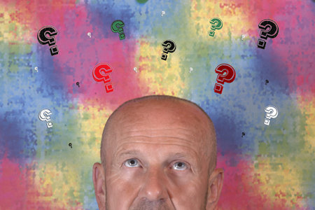 Man with many question marks