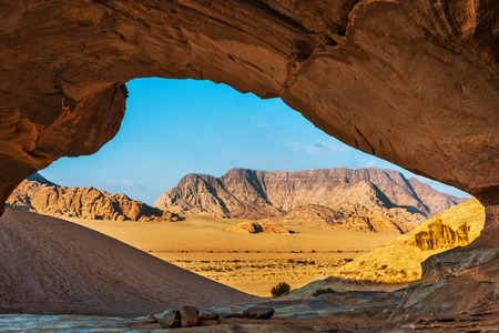 View through a rock arch in the desert of Wadi Rum, Jordan, Middle Eastの写真素材