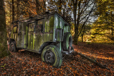 Abandoned military trailer in a forestの写真素材