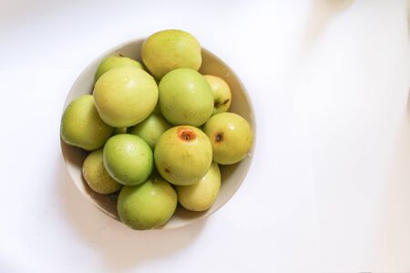 monkey apple in bowl white backgroudの写真素材
