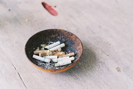 old wood ashtray on the table film photo